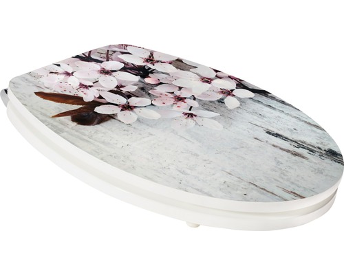 Toaletné sedadlo s kvetinovým vzorom na vzhľade dreva