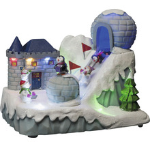 Dekoratívna zimná krajina s hradom, iglu, tučniakmi, snehuliakmi a lyžiarmi