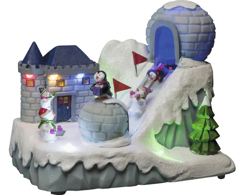 Dekoratívna zimná krajina s hradom, iglu, tučniakmi, snehuliakmi a lyžiarmi