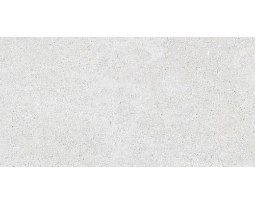 Detail svetlej podlahovej dlaždice so škvrnitou textúrou