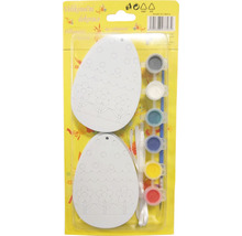 Veľkonočné vajíčka na vyfarbenie s farbami a štetcom zabalené v sade.