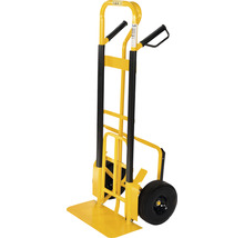 Žltý rudel s čiernou rukoväťou a kolieskami na prepravu