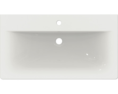 Pohľad zhora na obdĺžnikové keramické umývadlo s otvorom pre batériu a prepadom