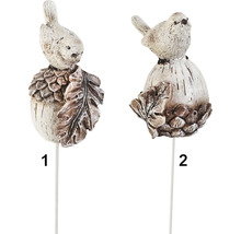 Dva záhradné kolíky s vtákom a listami na základni