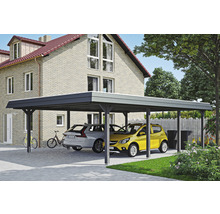 Prístrešok pre auto s dvoma zaparkovanými autami pred domom.