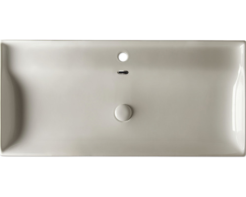 Pohľad zhora na umývadlo s prepadom a odtokom.