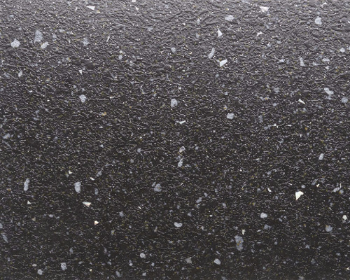 Detailný pohľad na štruktúrovaný povrch so škvrnami