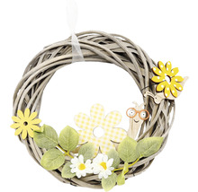 Dekoratívny veniec s kvetinovými a slimákovými motívmi pre jarnú atmosféru.