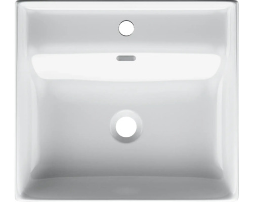 Pohľad zhora na biele keramické umývadlo s otvorom pre batériu a prepadom