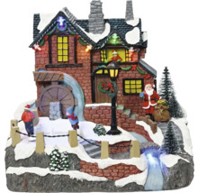 Vianočná dedina s vodným mlynom, Santa Clausom a deťmi