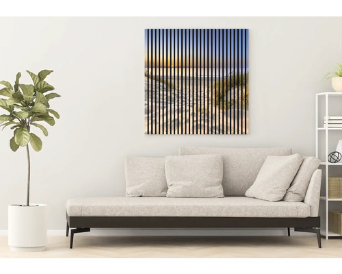 Dekoratívne nástenné umenie s motívom pláže nad pohovkou