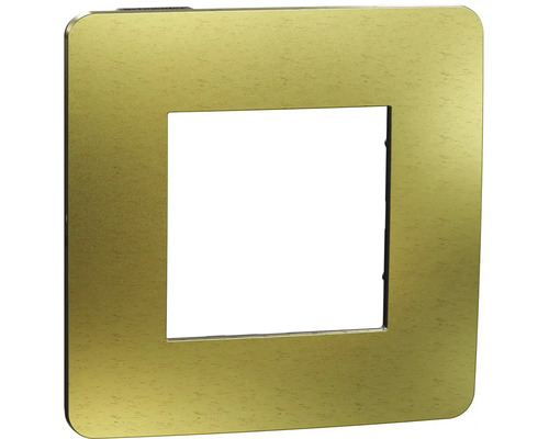 Štvorcový kryt vypínača zlatej farby.