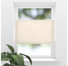 Béžová plisovaná žalúzia na okne na reguláciu svetla