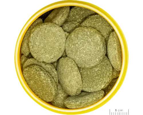 Tablety pre ryby v žltej nádobe