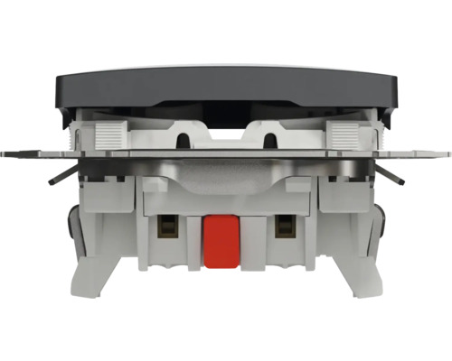 Detailný pohľad na spínač s kovovými prvkami a červeným tlačidlom