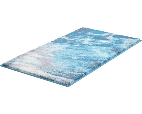 Obdĺžnikový koberec s abstraktným vzorom v rôznych odtieňoch