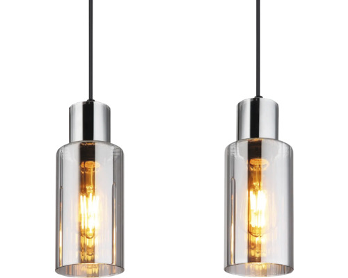 Dve závesné svietidlá s čírym sklom a kovovými hornými časťami.