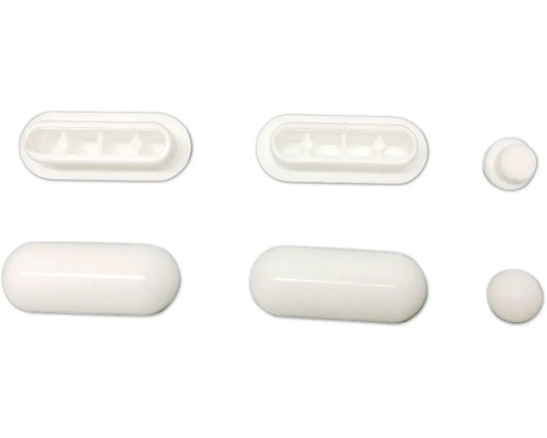 Rôzne biele plastové klzáky na nábytok