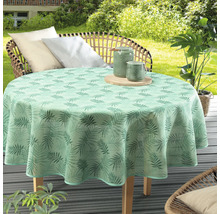 Okrúhly stôl so zeleným obrusom s rastlinným vzorom na terase