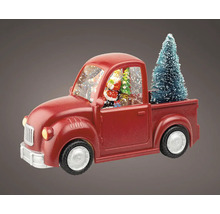 Dekoratívna červená snehová guľa v tvare nákladného auta s vianočným stromčekom a figúrkou Santa Clausa