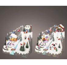 Dekoratívna zimná dedinka so zjazdovkou a osvetlením