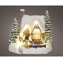 Dekoratívna zasnežená krajina s domom, stromami a figúrkami, osvetlená, pre vianočnú atmosféru