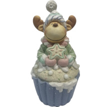 Dekoratívna figúrka losa v tvare muffinu s hviezdou